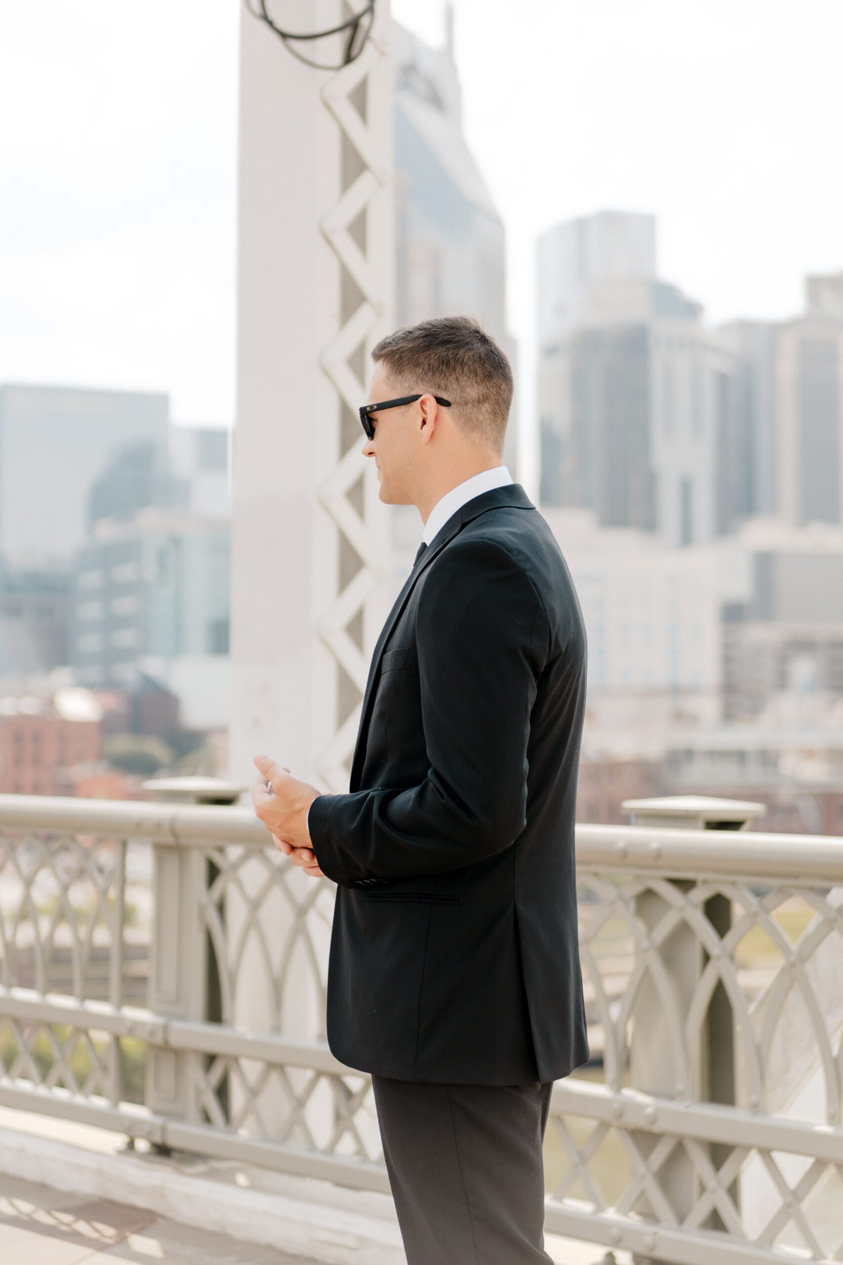 first look with groom on the pedestrian bridge in nashville