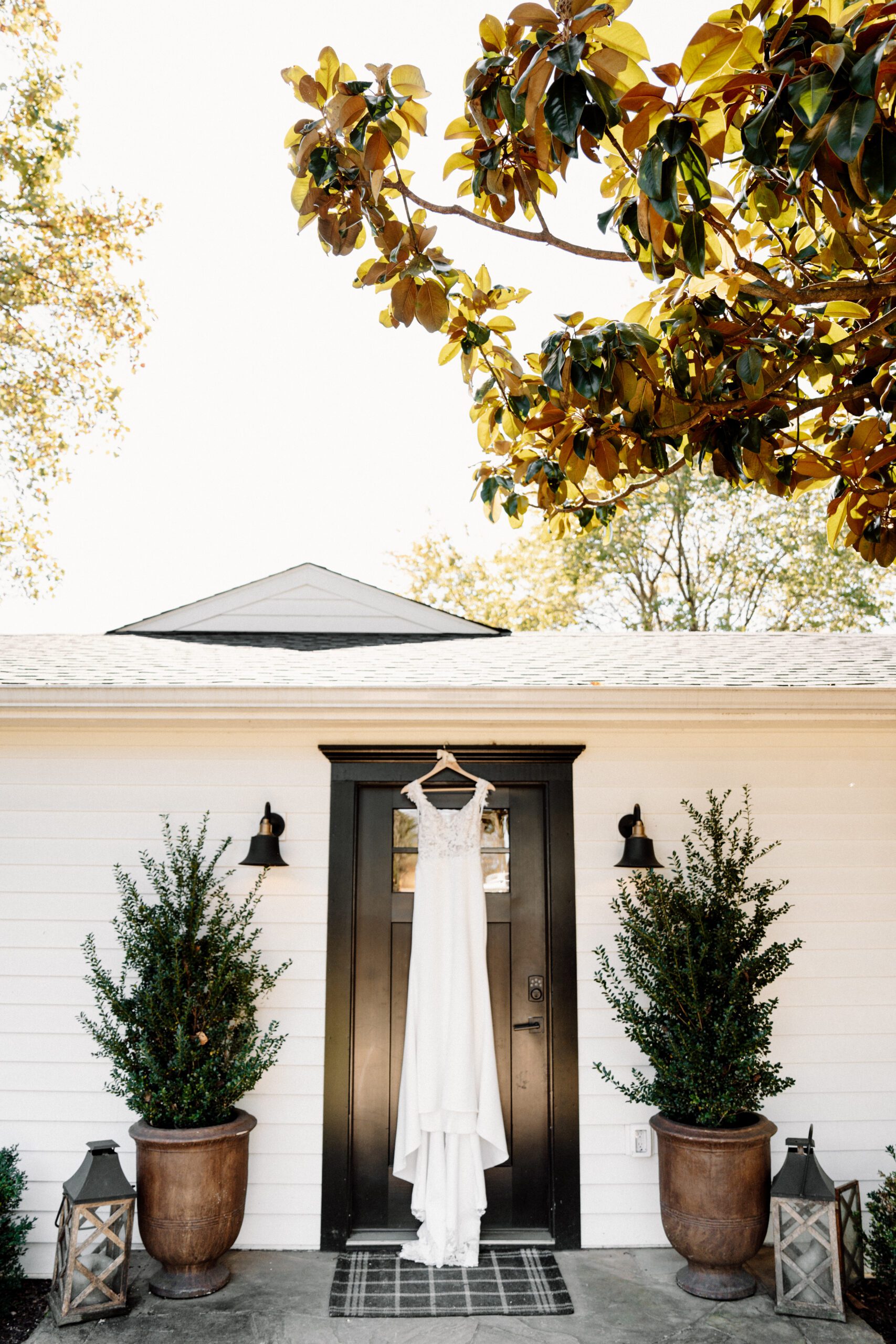 wedding dress hanging outside bridal suite at the market at grelen in virginia