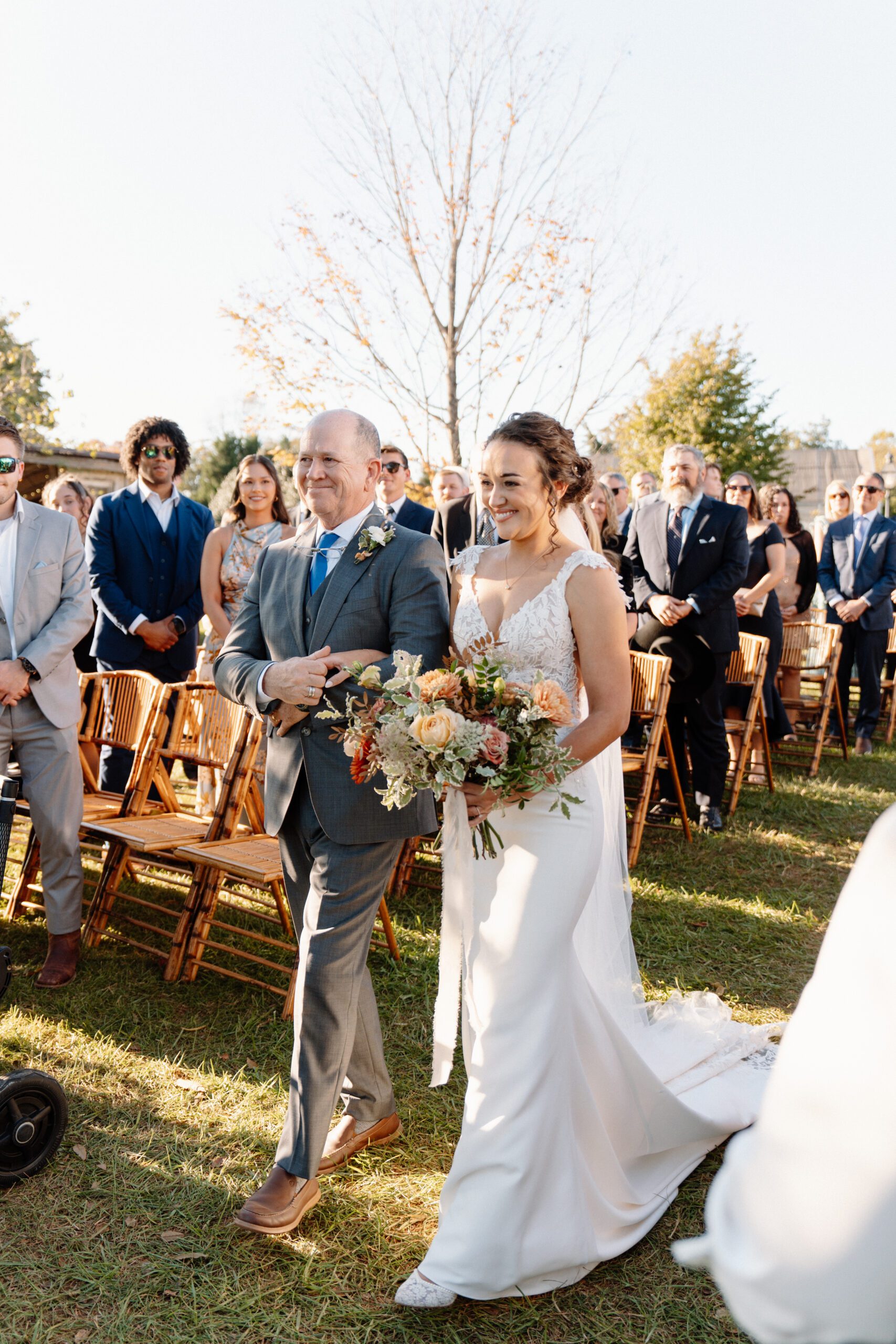 bride walking down the aisle with father at the market at grelen ceremony in virginia