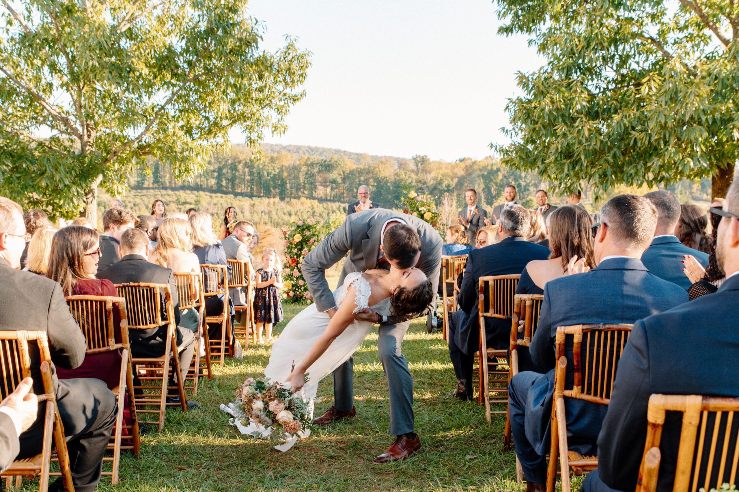 end of the aisle kiss with bride and groom after the ceremony at the market at grelen in virginia