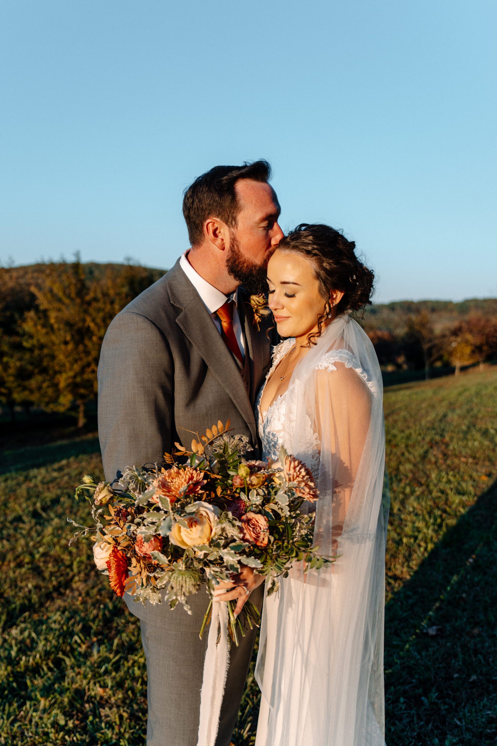 bride and groom during sunset newlywed photos at the market at grelen wedding in the fall