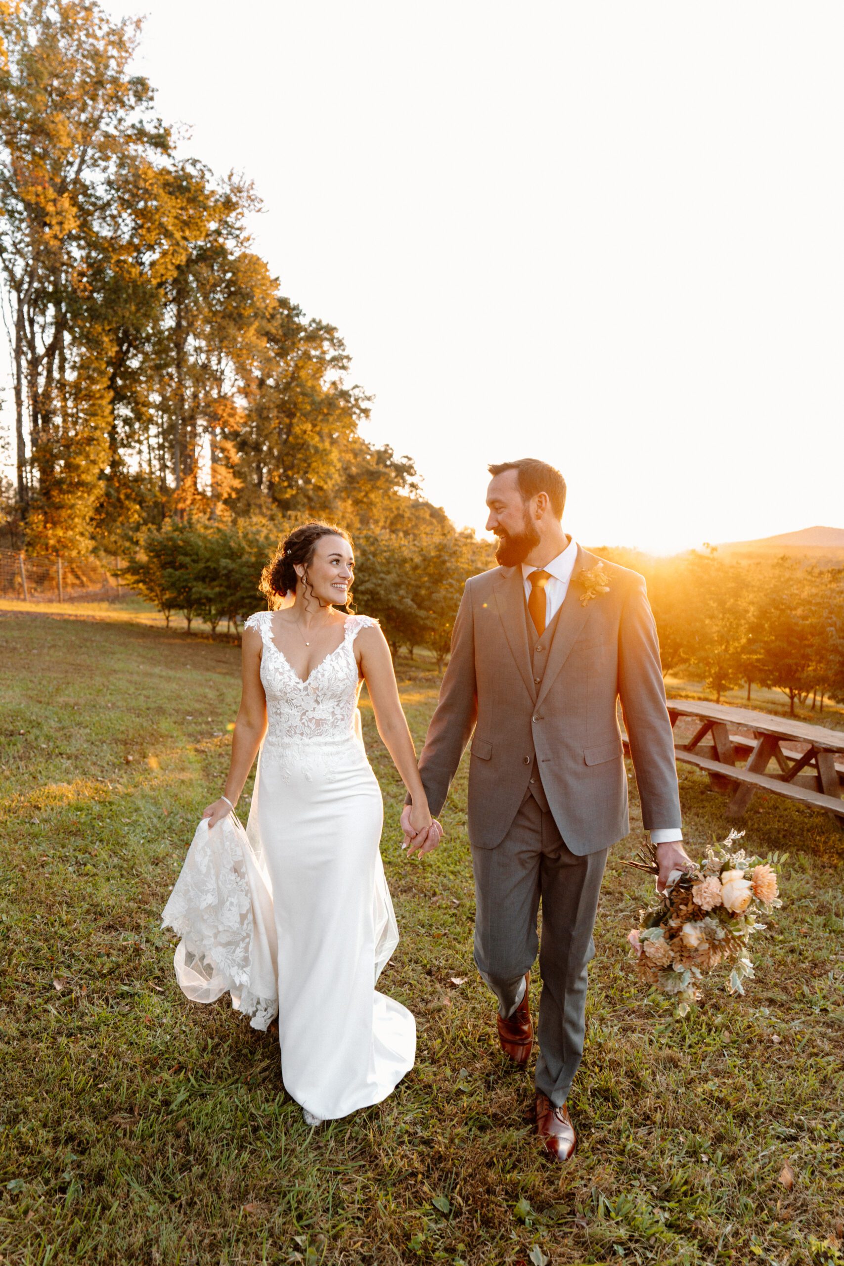 bride and groom during sunset portraits at the market at grelen wedding in the fall