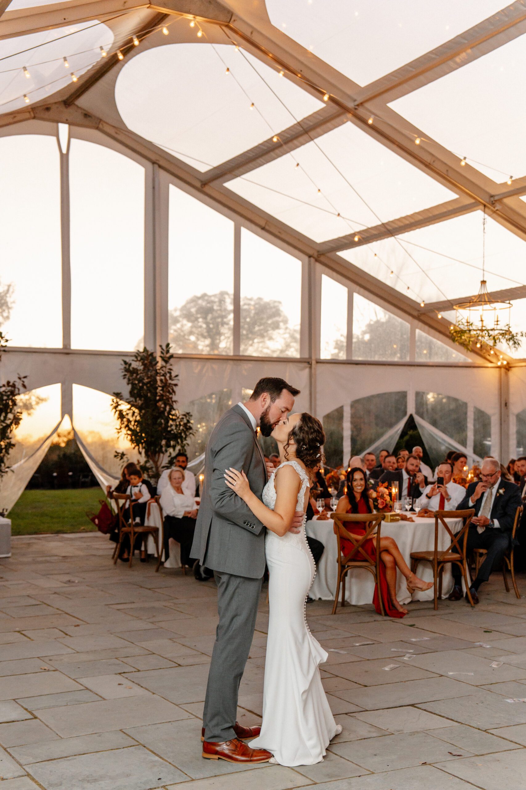 bride and groom during sunset first dance at the market at grelen wedding in the fall