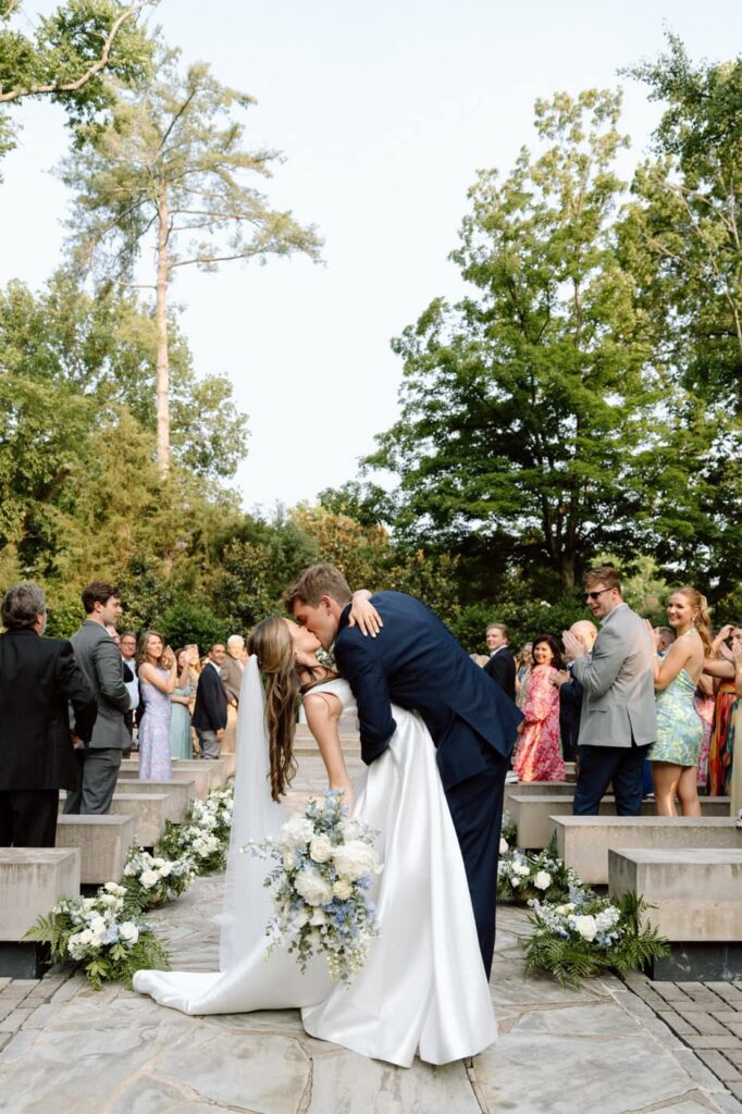 Couple kissing at the end of the aisle at the ceremony at Belle Meade Historic Site & Winery wedding in Nashville