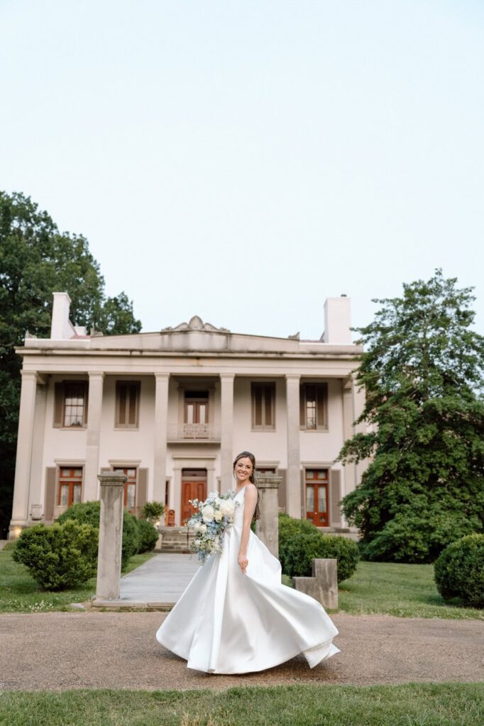 portrait of the bride twirling on the Belle Meade lawn