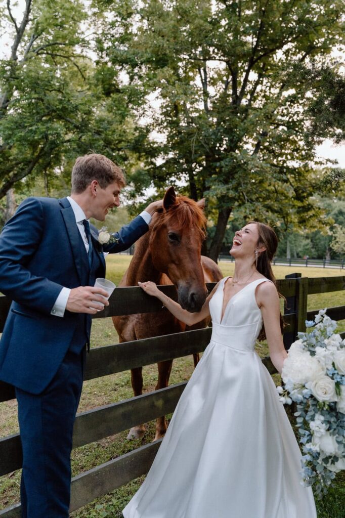 Couple laughing together during portraits at Belle Meade in May