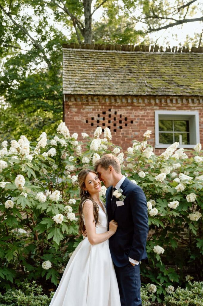 Couple laughing together during portraits at Belle Meade in May
