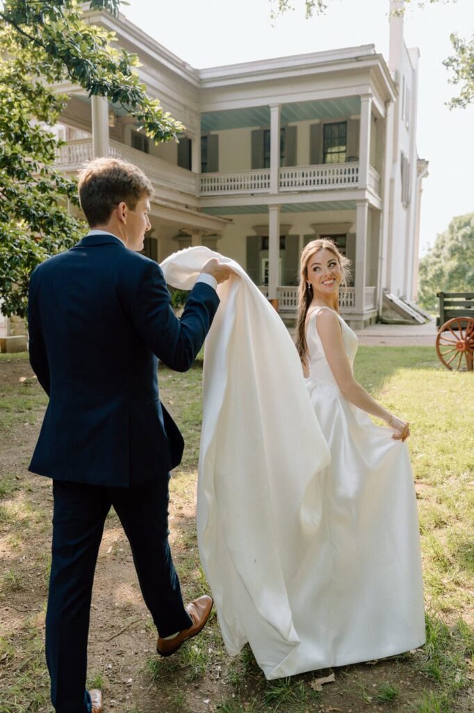 Couple walking together along the side of the mansion at Belle Meade Historic Site & Winery Wedding in Nashville