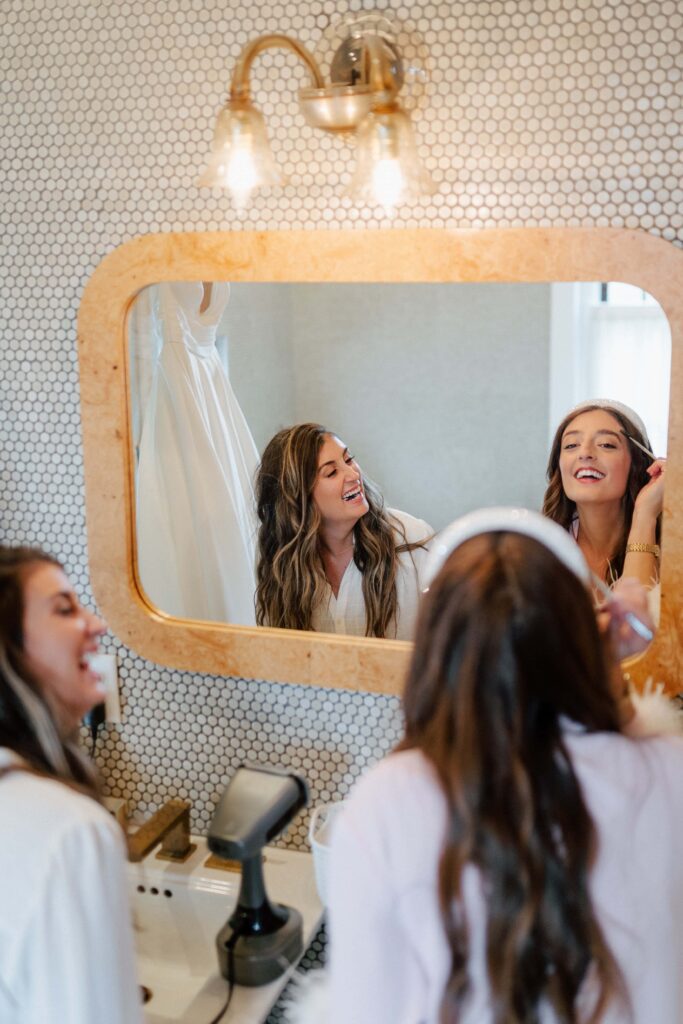 Candid moment of the bride getting ready on her wedding day