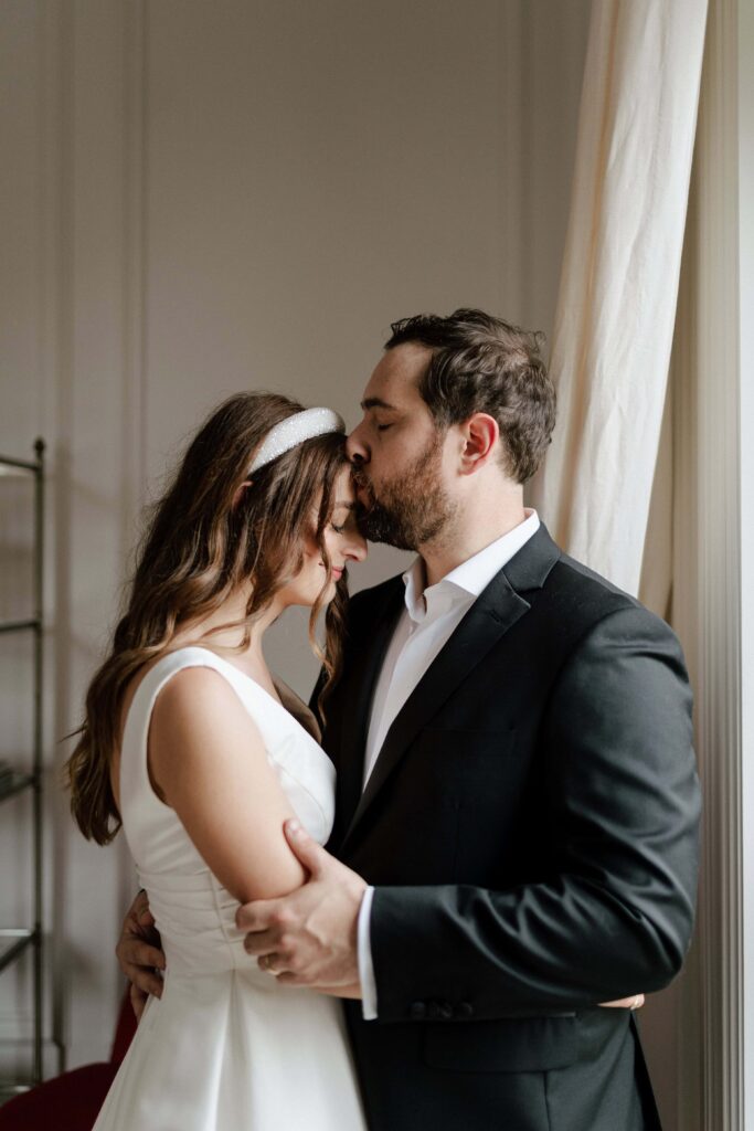 Soft embrace between the couple during a candid photo