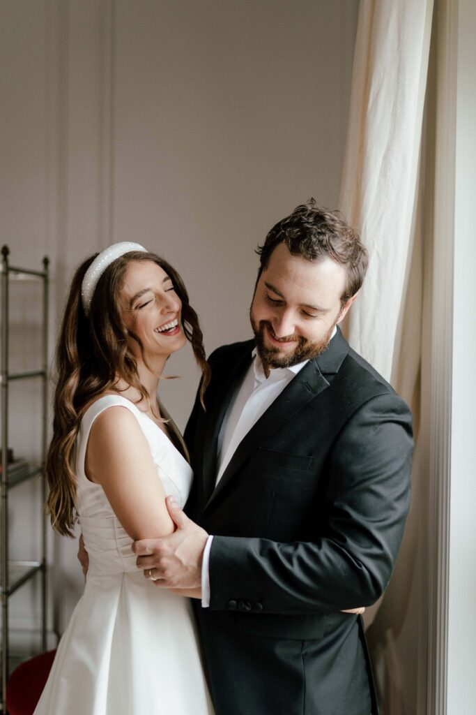 Candid laugh between the couple during candid wedding photography in nashville