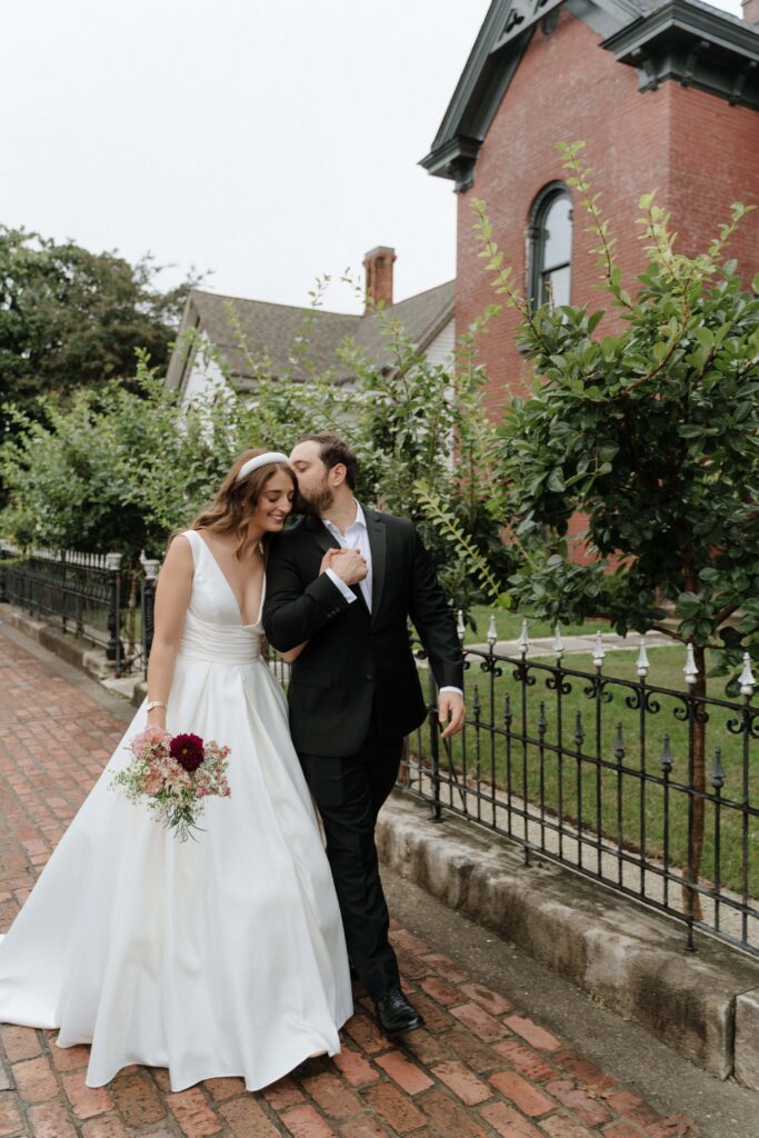 Couple walking through Germantown on their wedding day