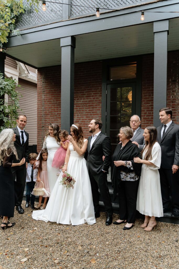 couple laughing with their family before their ceremony in nashville