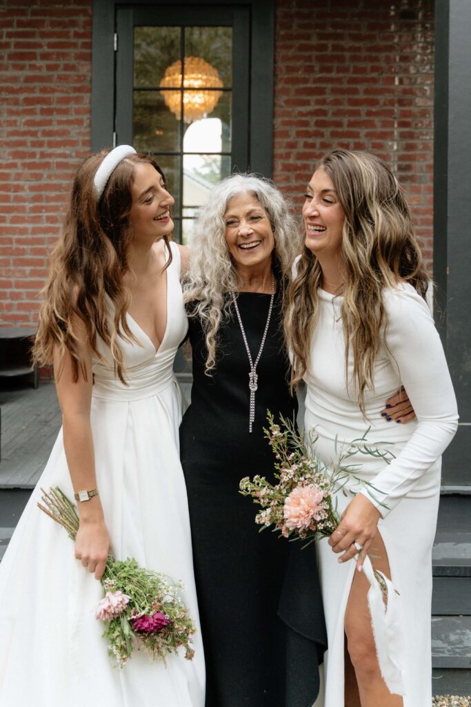 candid laugh between the bride and her family at her wedding in nashville