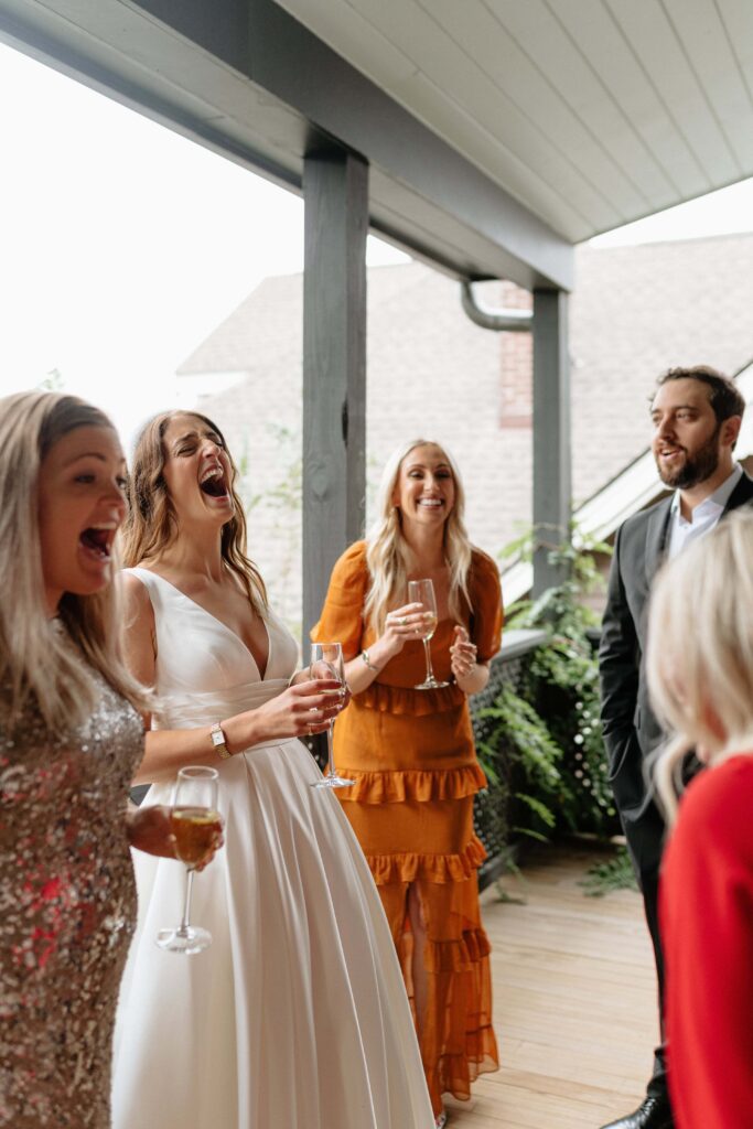 Bridal party candidly interacting together
