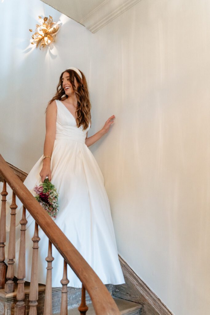 bride walking down the stairs of germantown venue