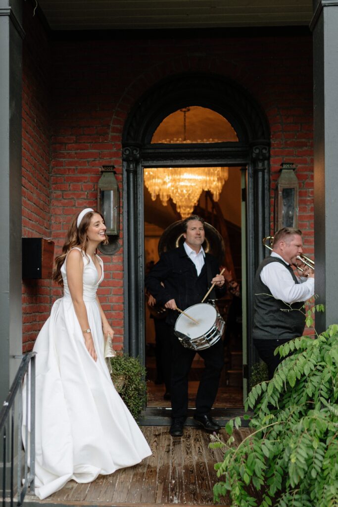 bride waiting on wedding guests to walk through germantown in nashville