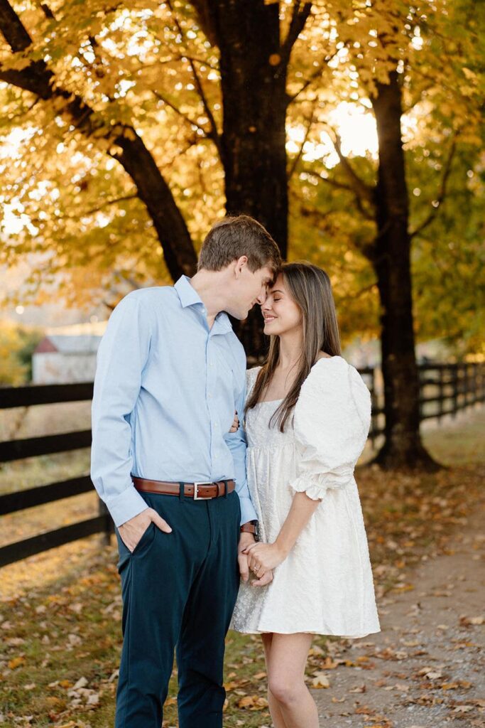 Soft moment of a couple holding each other in a natural outdoor setting