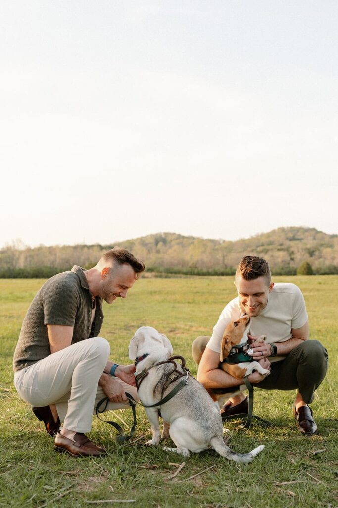 Couple playing with their dogs along a nature trail in Nashville