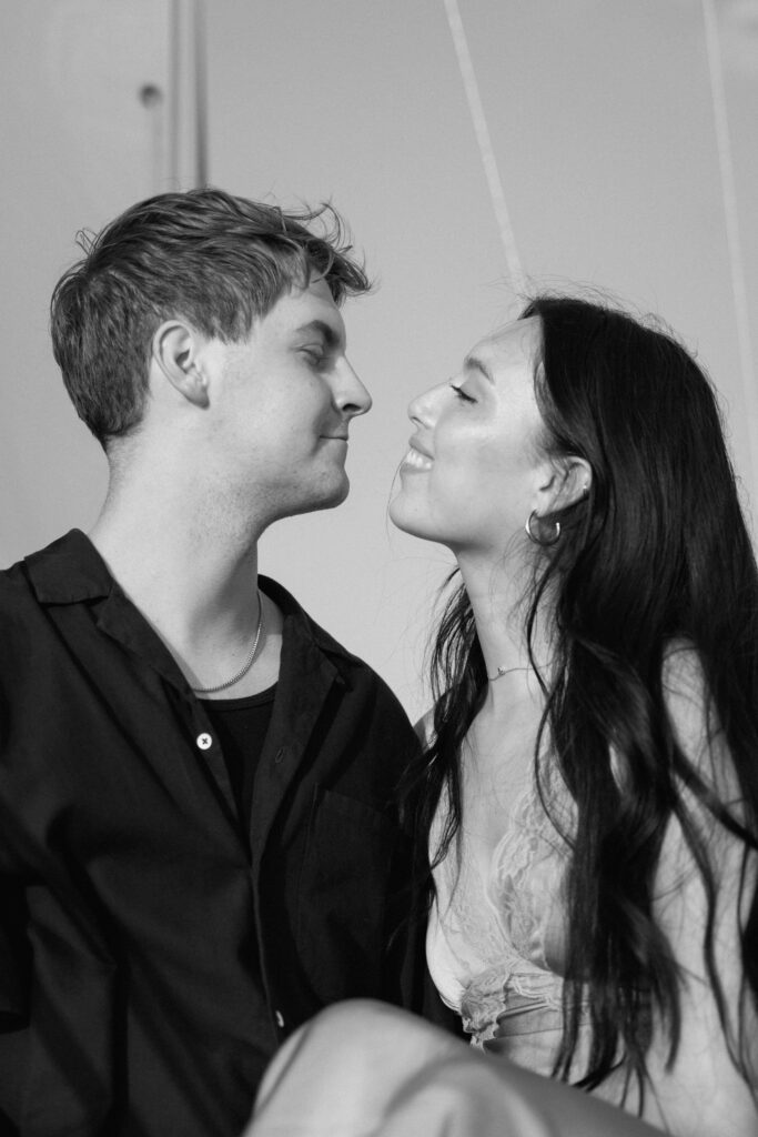 Candid laughter during a sunset sailboat session on Percy Priest
