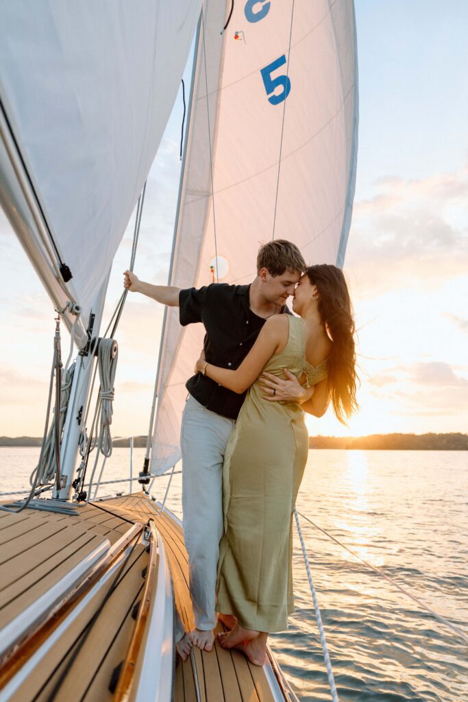 Warm golden light reflecting across Percy Priest Lake behind the couple
