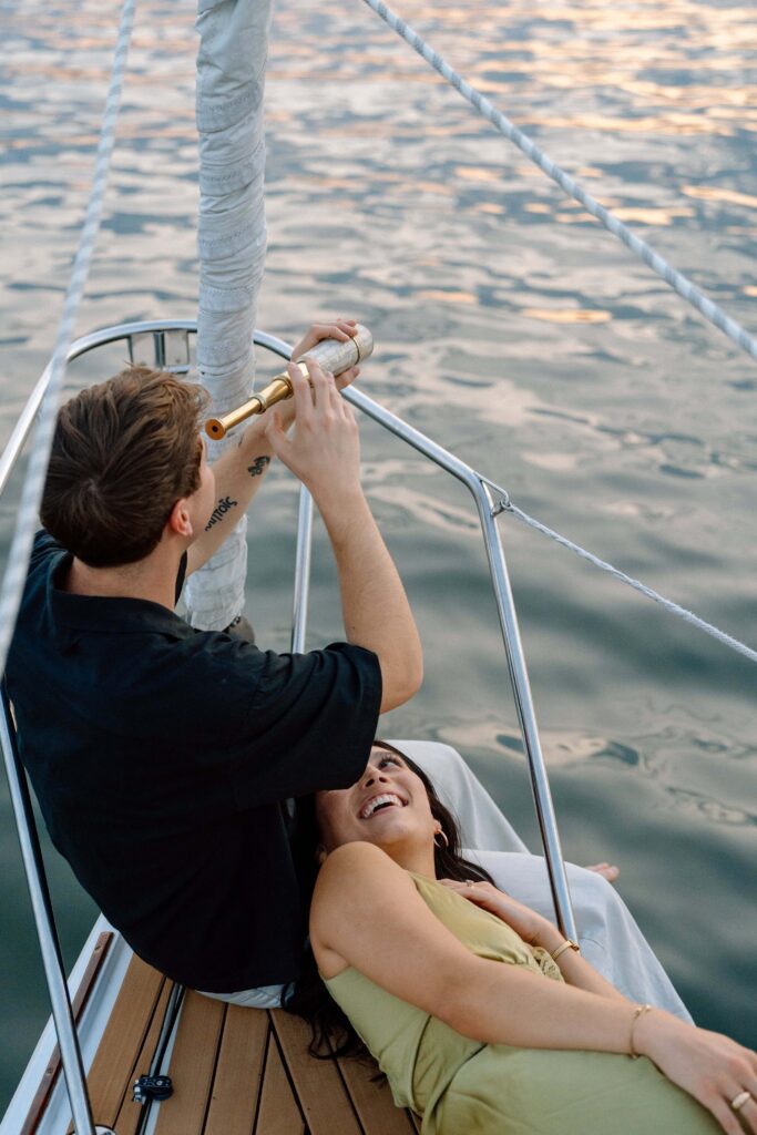 Candid laughter during a sunset sailboat session on Percy Priest
