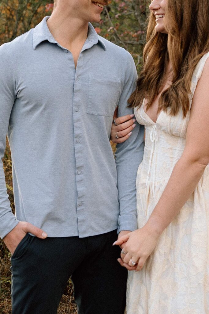 Couple smiling at each other during a relaxed moment at Shelby Bottoms