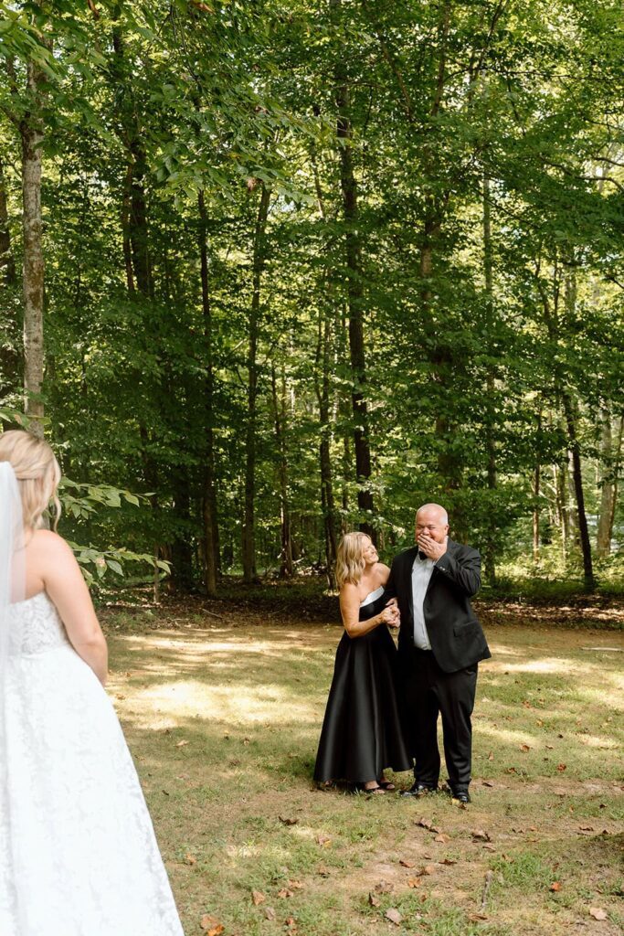 brides first look with dad and her dad is getting emotional