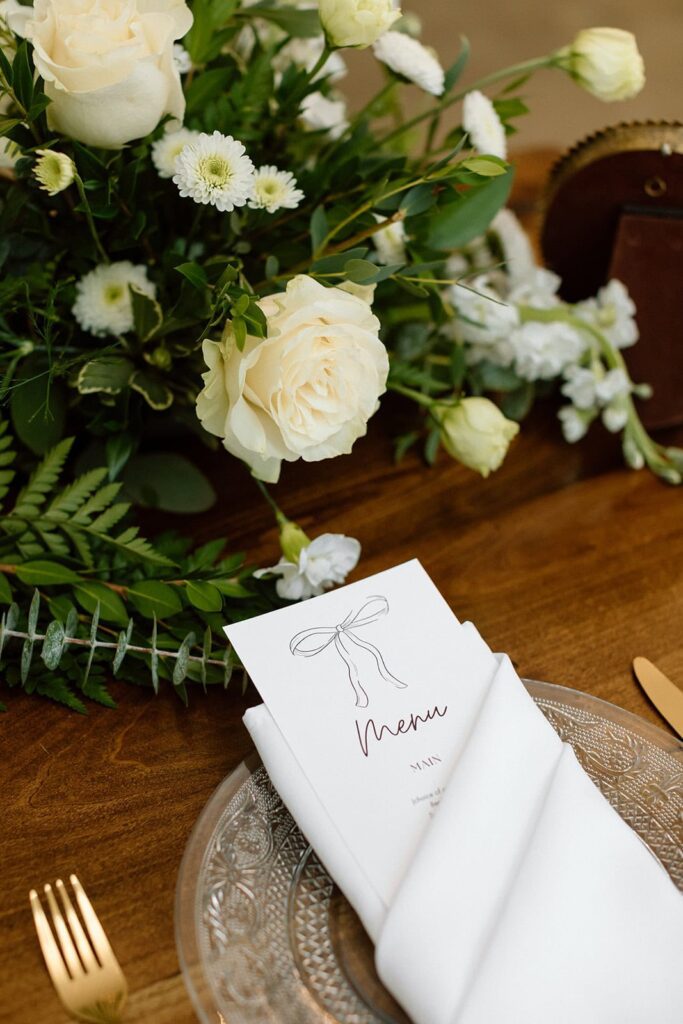 Table menu and florals at reception space at the Chapel at Firefly Lane in Dickson, Tennessee