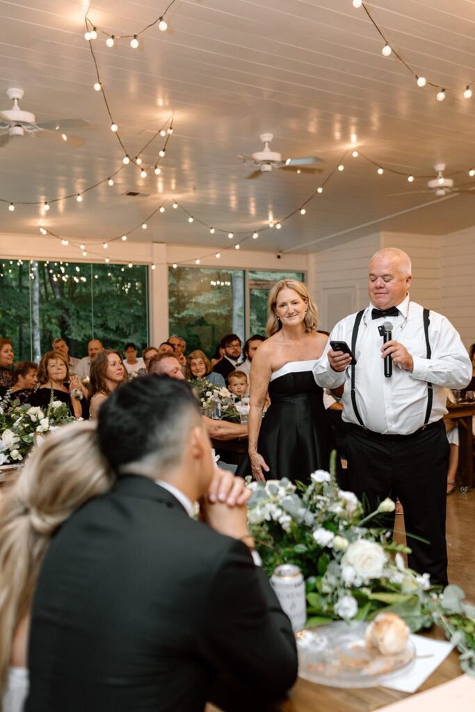 Parents of bride giving a toast at the wedding reception at the chapel at firefly lane