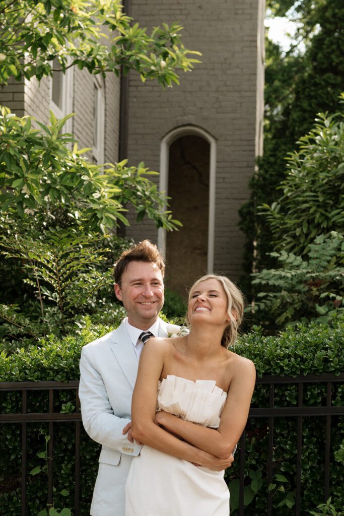 couple taking portraits outside of the cordelle in nashville