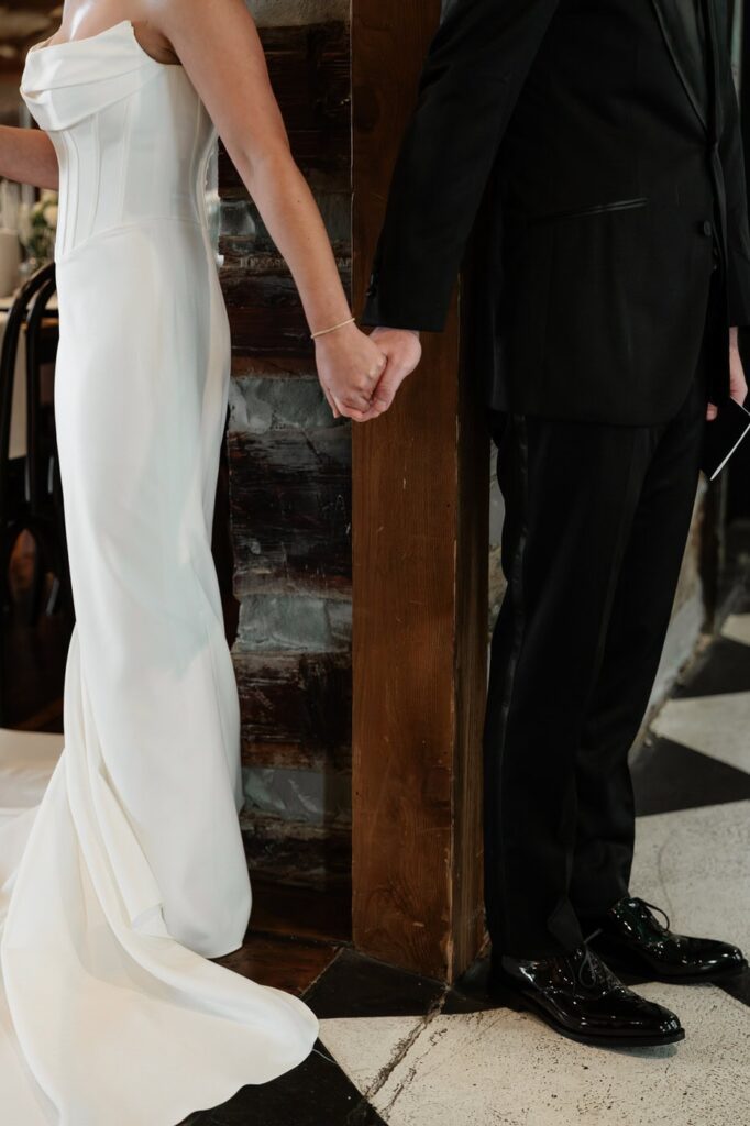 couple holding hands during first touch at estelle