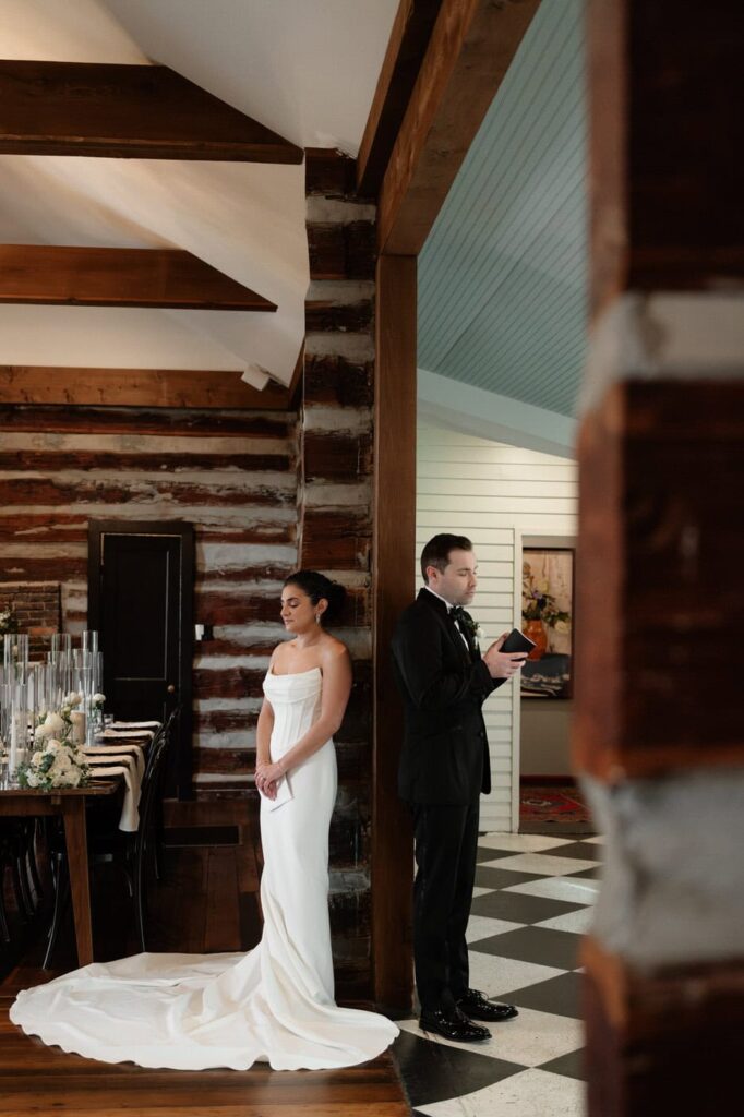 couple reading their vows in the main room at estelle