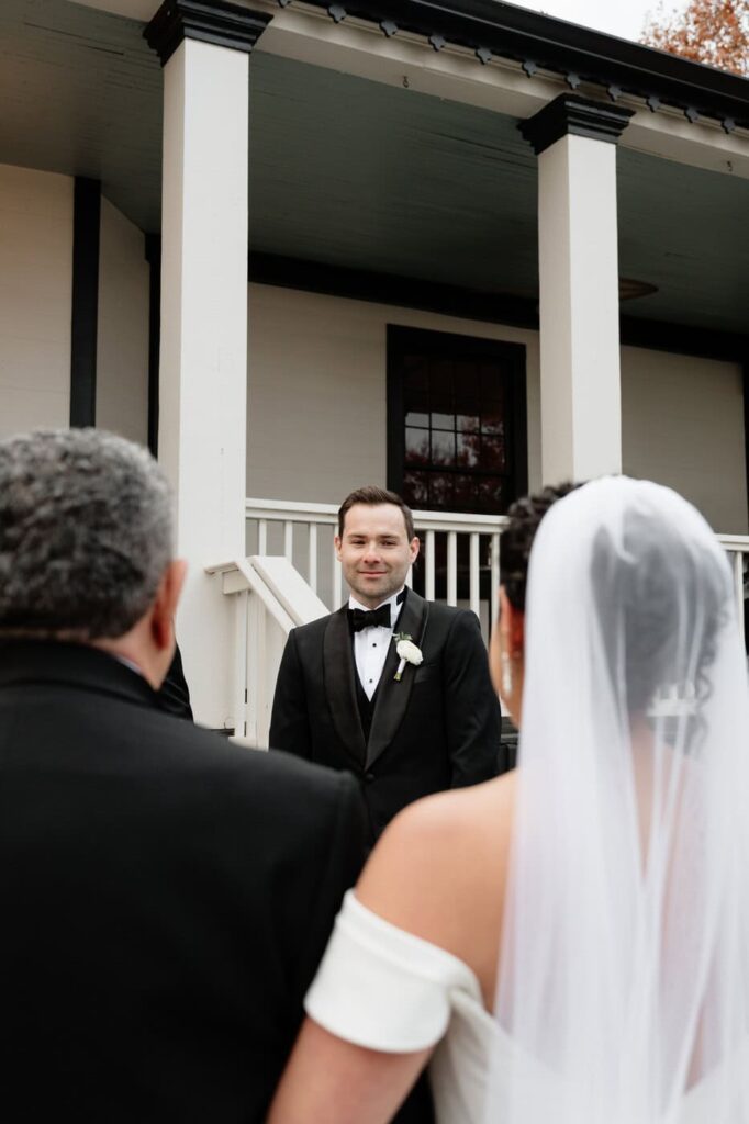 groom seeing bride for the first time at the wedding