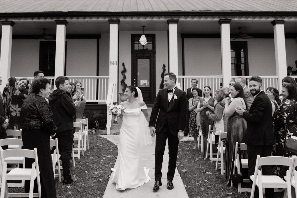 couple walking back down the aisle after wedding ceremony in east nashville