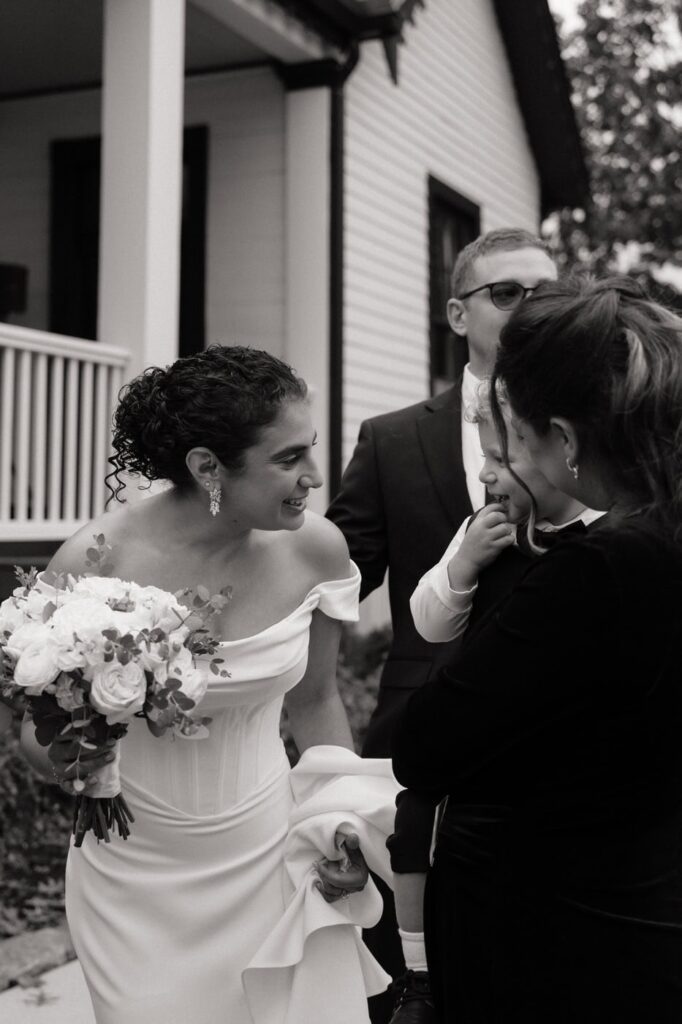 bride laughing with family at east nashville wedding venue
