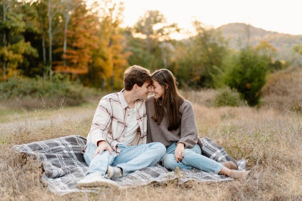couple sharing a sweet moment during their fall engagement photos in nashville
