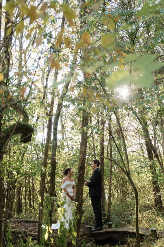 couple reading private vows in the woods on their wedding day in nashville