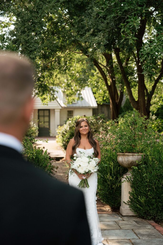 couple sharing a sweet moment after their first look on their wedding day at long hollow gardens