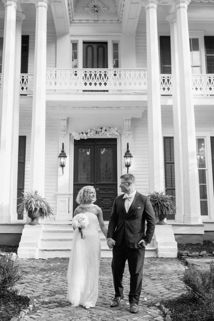 couple holding hands and walking away from venue in west tennessee