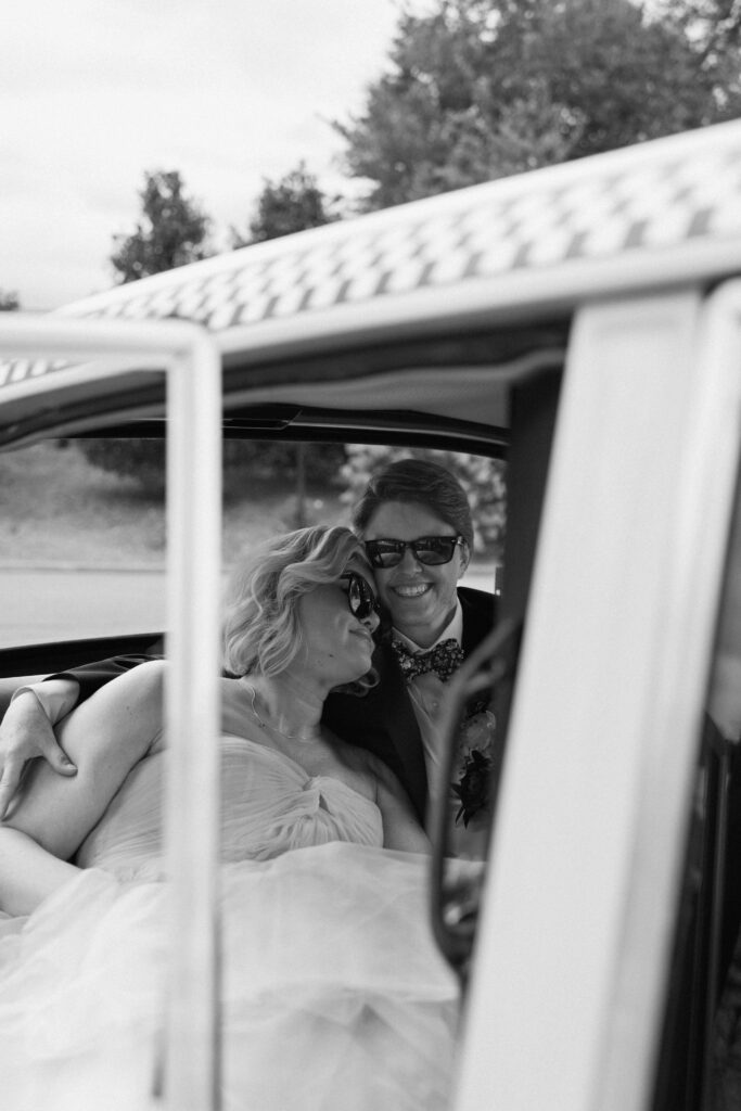 huntsville botanical garden wedding day with the couple smiling in a taxi cab