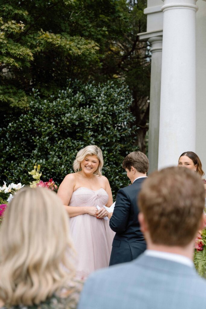 bride laughing at her partner during wedding vows