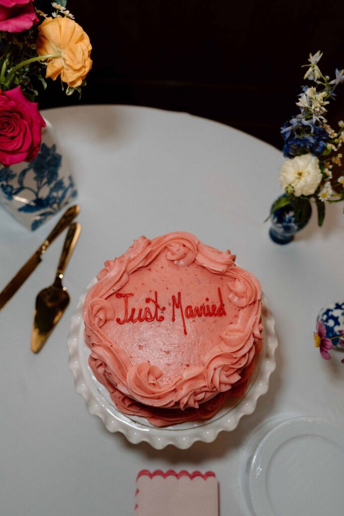 pink cake that says just married at huntsville botanical garden wedding