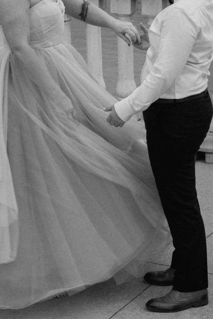 close up of couple dancing outside in black and white