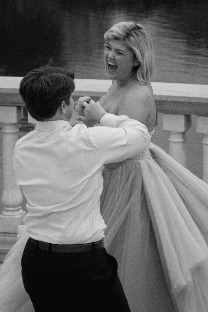 couple laughing while dancing outside