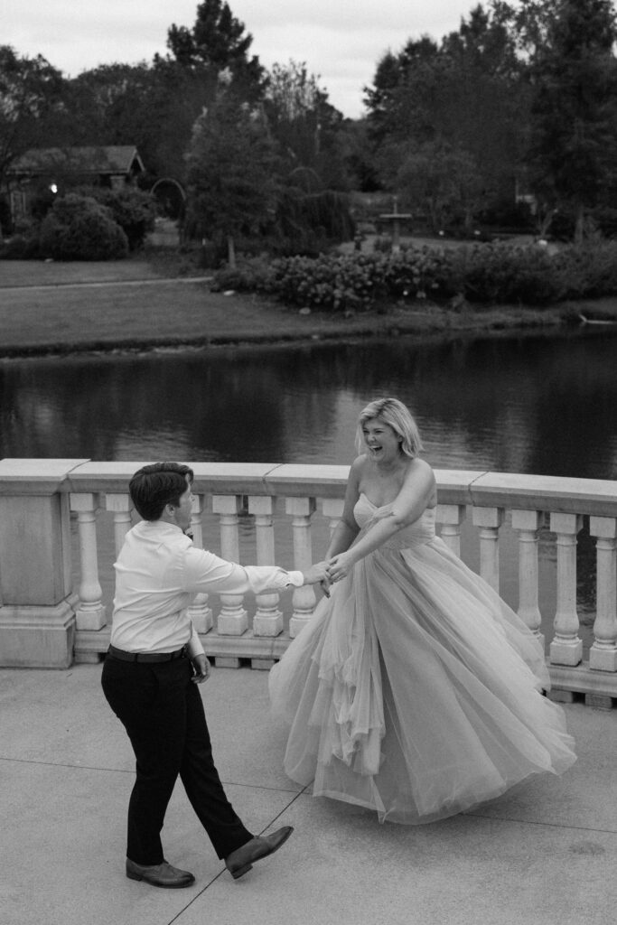 huntsville botanical garden wedding couple laughing while dancing during a candid moment