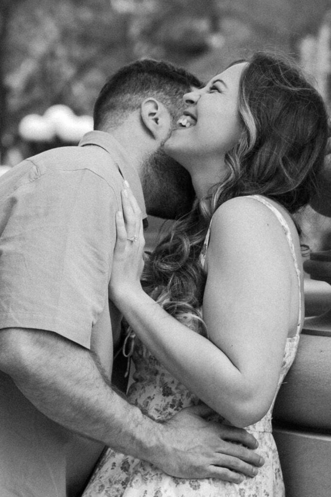 Couple laughing during a candid moment at Belmont engagement session in Nashville