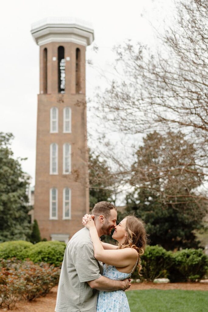 couple laughing candidly at belmont university during engagement photos