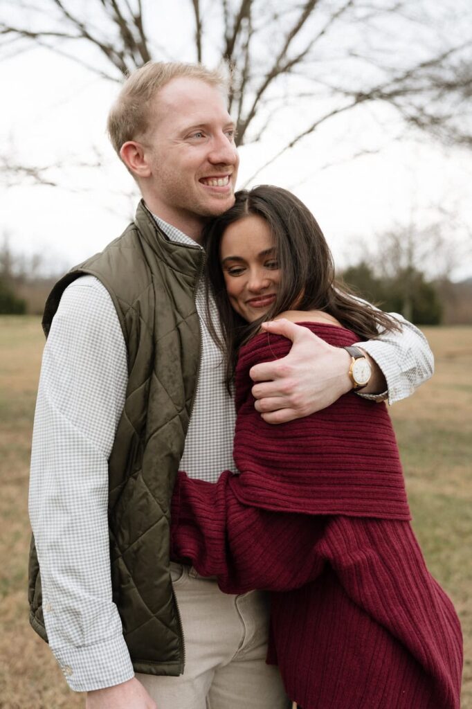 couple sharing a sweet candid moment after proposal in nashville