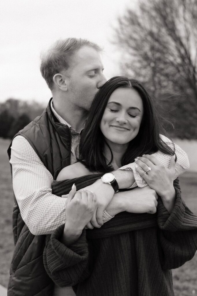 candid moment of couple embracing in franklin tennessee after proposal